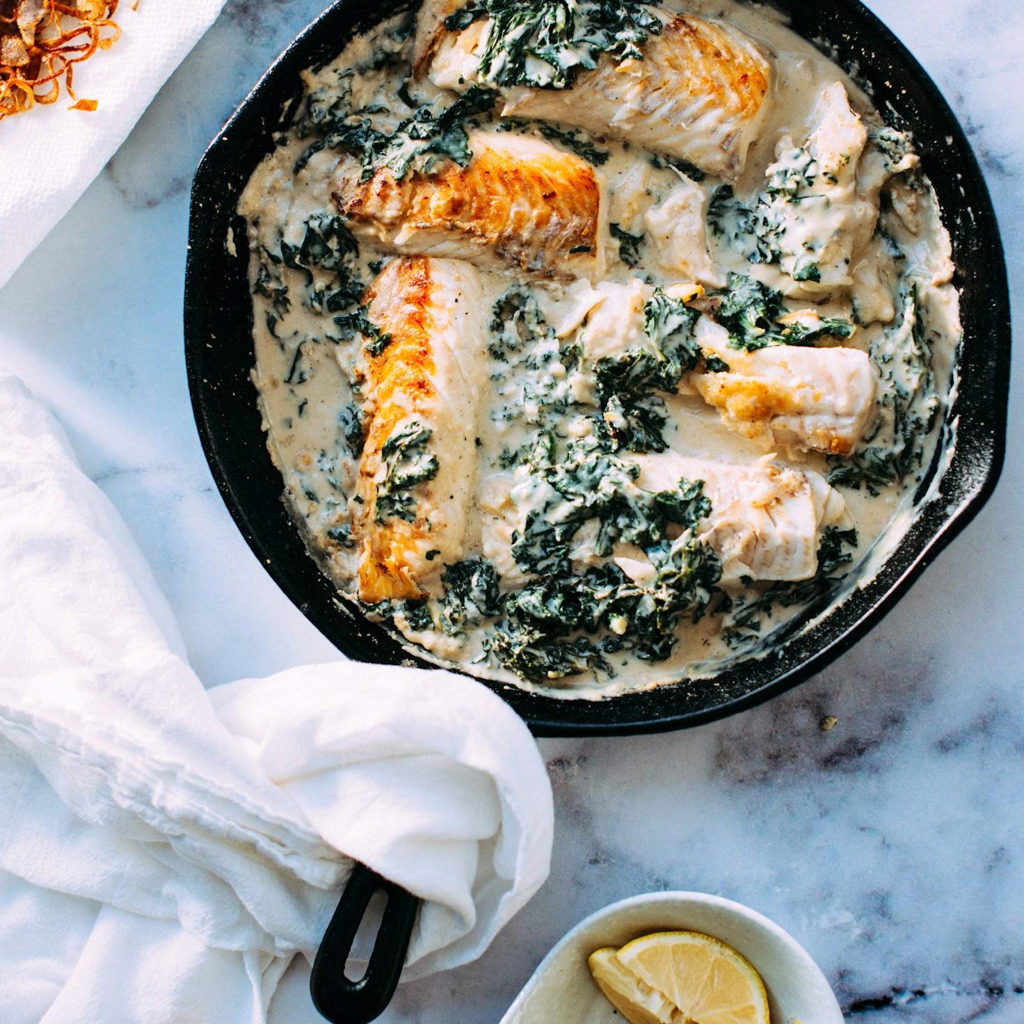Diverse group of community members sharing a meal, highlighting the friendships built through collaborative cooking